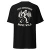 Back view of a black t-shirt featuring a white graphic of Bigfoot walking through a forest with pine trees, surrounded by the phrase “STAY GROUNDED MOVE WILD.”