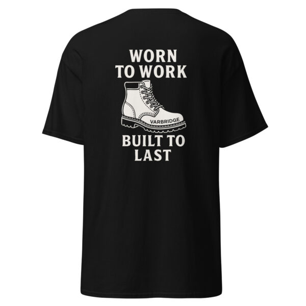 Black t-shirt with bold white graphic on the back featuring a rugged work boot illustration and the phrase “WORN TO WORK – BUILT TO LAST” with “VARBRIDGE” printed on the boot