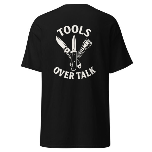 Black t-shirt with “Tools Over Talk” graphic on the back featuring white illustrations of a pocket knife, fixed blade knife, and flashlight arranged in a triangle