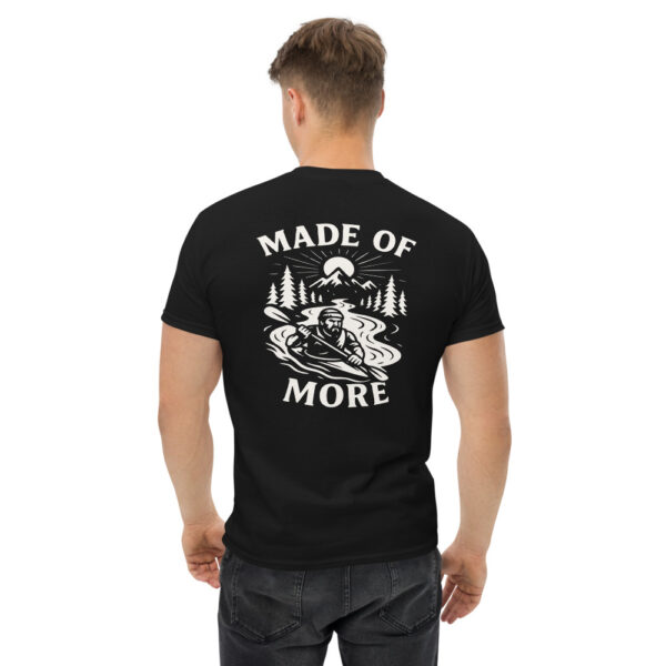 Man wearing black Varbridge t-shirt with “Made of More” kayaker and mountain graphic on back