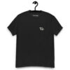 Front view of a black t-shirt hanging on a hook with a small white “Vb” Varbridge logo on the left chest.