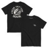 Black t-shirt featuring a bold white back graphic of a fish leaping from flames toward a fishing hook, surrounded by the phrase “FRESH OFF THE HOOK.” Front displays a minimalist “Vb” logo on the chest.