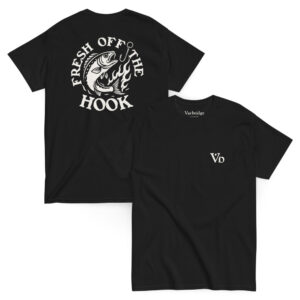 Black t-shirt featuring a bold white back graphic of a fish leaping from flames toward a fishing hook, surrounded by the phrase “FRESH OFF THE HOOK.” Front displays a minimalist “Vb” logo on the chest.
