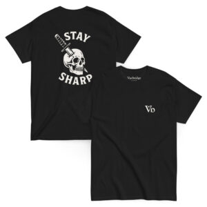 Black Varbridge t-shirt shown front and back; back features a striking white skull graphic with a knife through it and bold text reading “Stay Sharp,” while the front has a minimal “Vb” logo on the chest