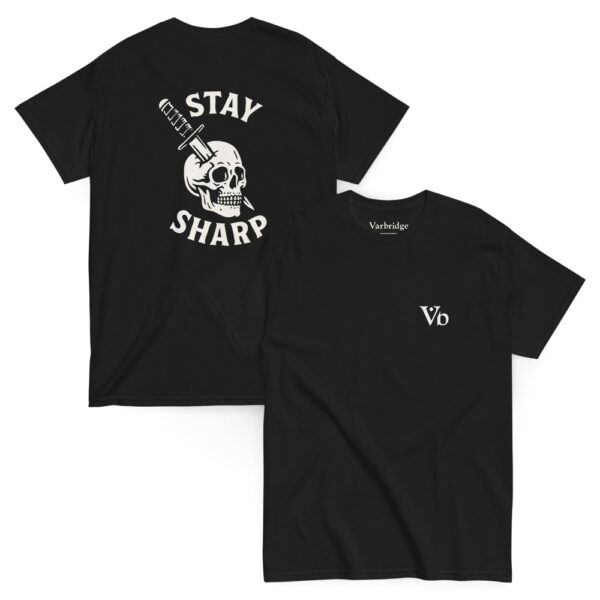Black Varbridge t-shirt shown front and back; back features a striking white skull graphic with a knife through it and bold text reading “Stay Sharp,” while the front has a minimal “Vb” logo on the chest