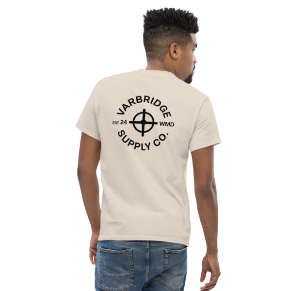 Man wearing Varbridge Supply Co. t-shirt with circular compass-style logo on back