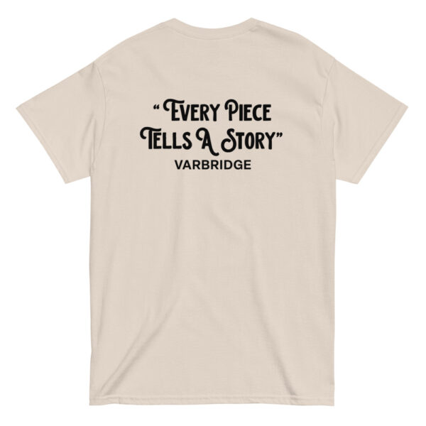 Beige Varbridge t-shirt with “Every Piece Tells a Story” graphic on back